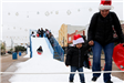 People Sliding down a Snow Slide