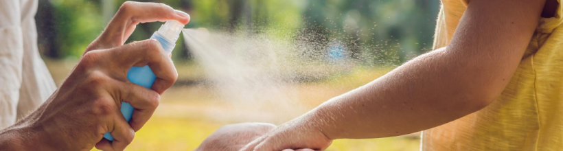 Adult Spraying Mosquito Repellent on a Childs Arm (PNG)