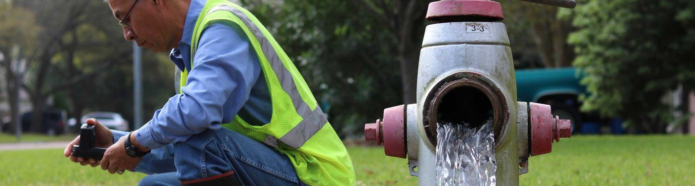 Public Works Worker Flushing a Hydrant